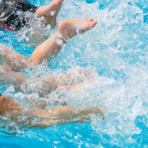 Children splashing in the pool